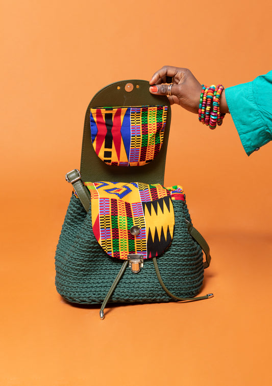 crocheted, forest/ oak green bag, with an African style print. opened showing compartments.