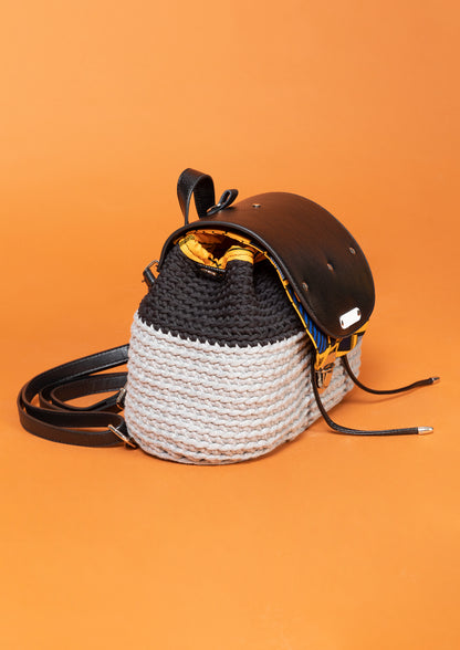crocheted, black and grey bag, with an African style, orange print