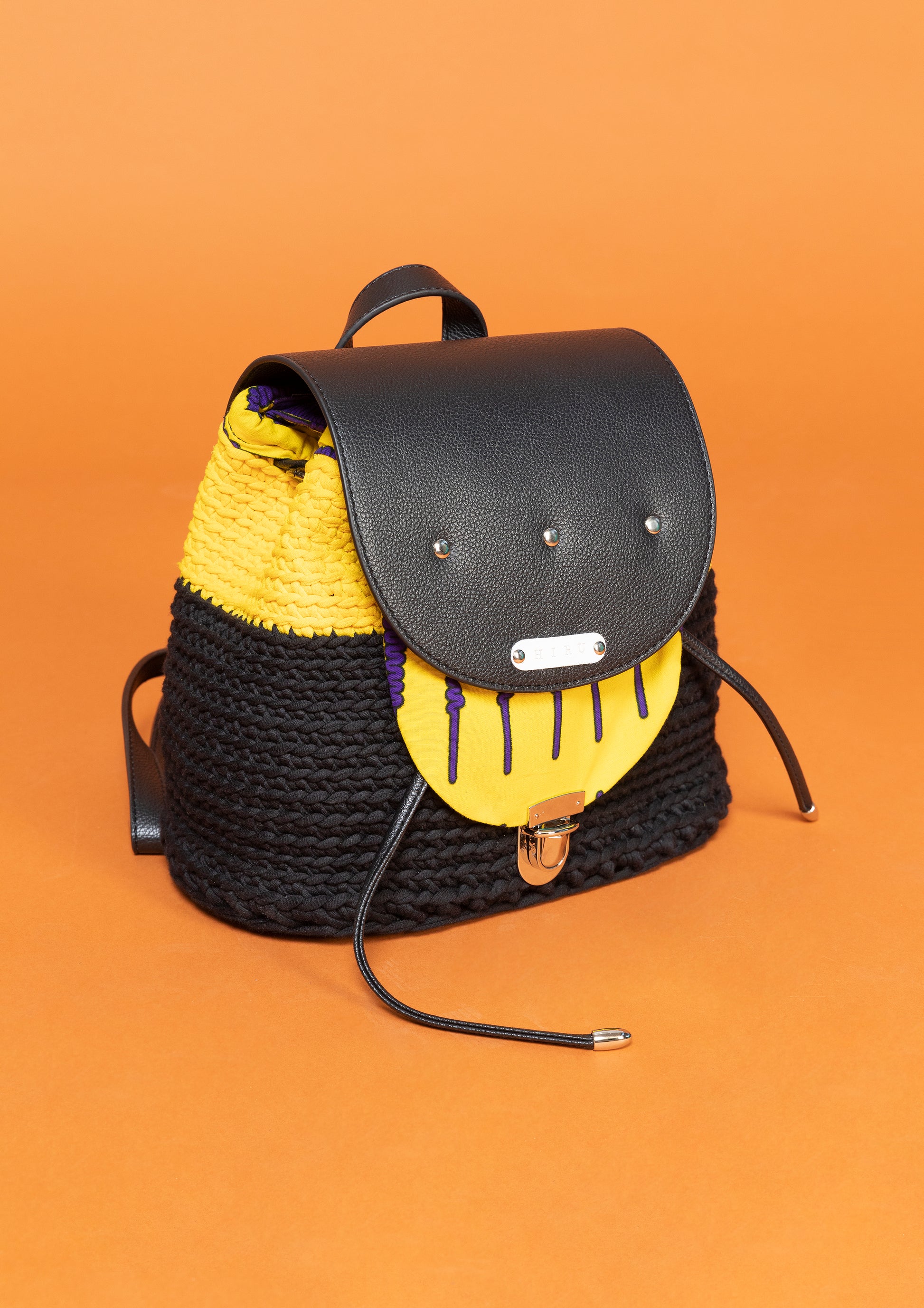 crocheted, black and yellow bag, with an African style print