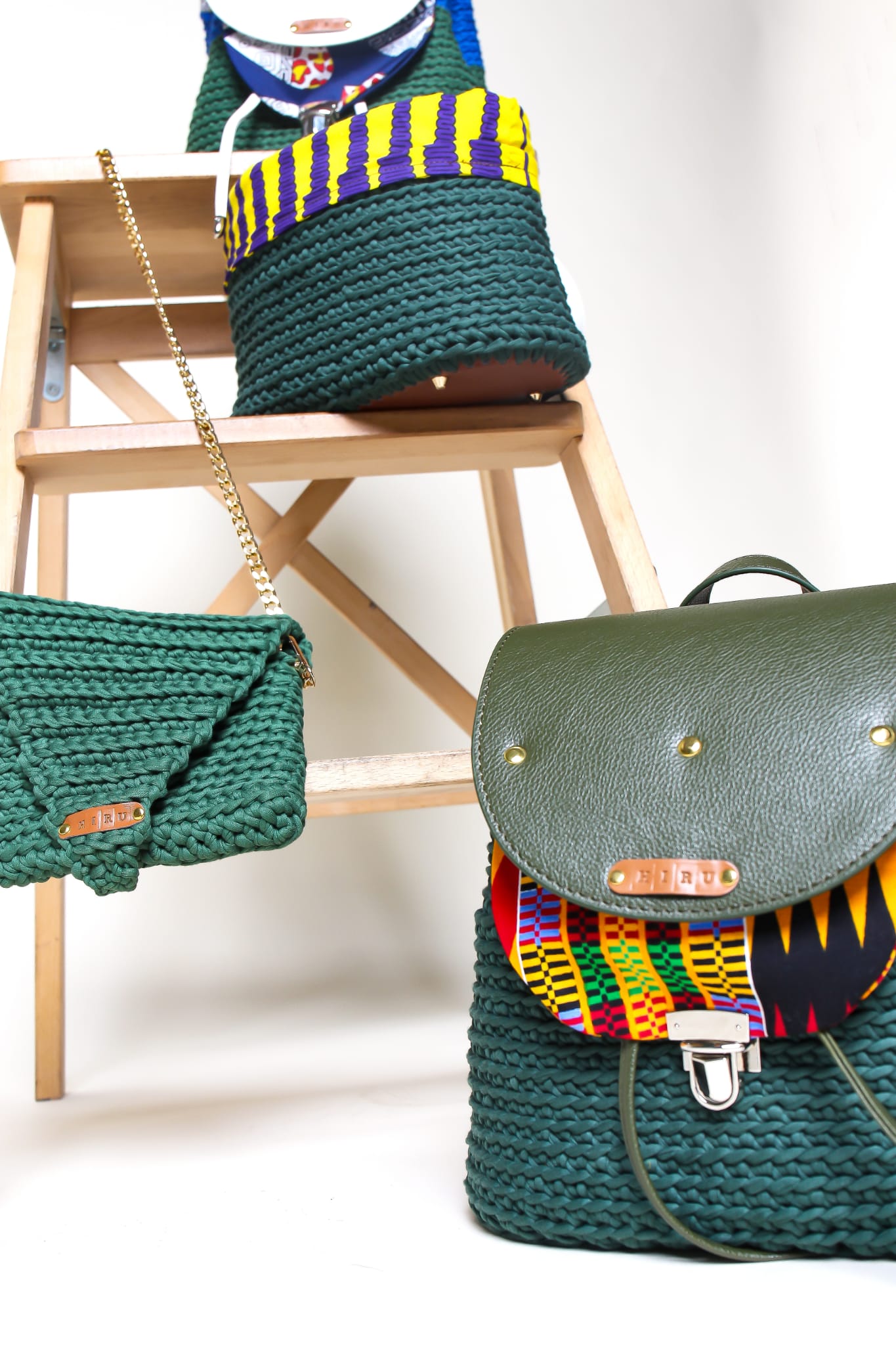 crocheted, forest/ oak green bag, with an African style print. Shown with matching, crocheted, green clutch bag.